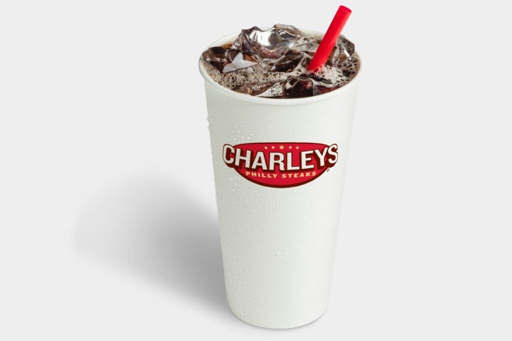 Charleys Coca-Cola soft drink in a white cup with a red straw and Charleys logo on the front